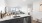 Kitchen with quartz countertop and spacious living room