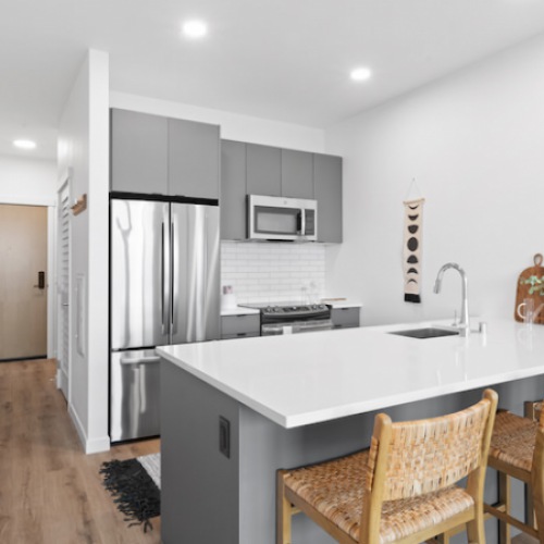 Kitchen with quartz countertop and plenty of seating space space Kitchen with quartz countertop and plenty of seating space space