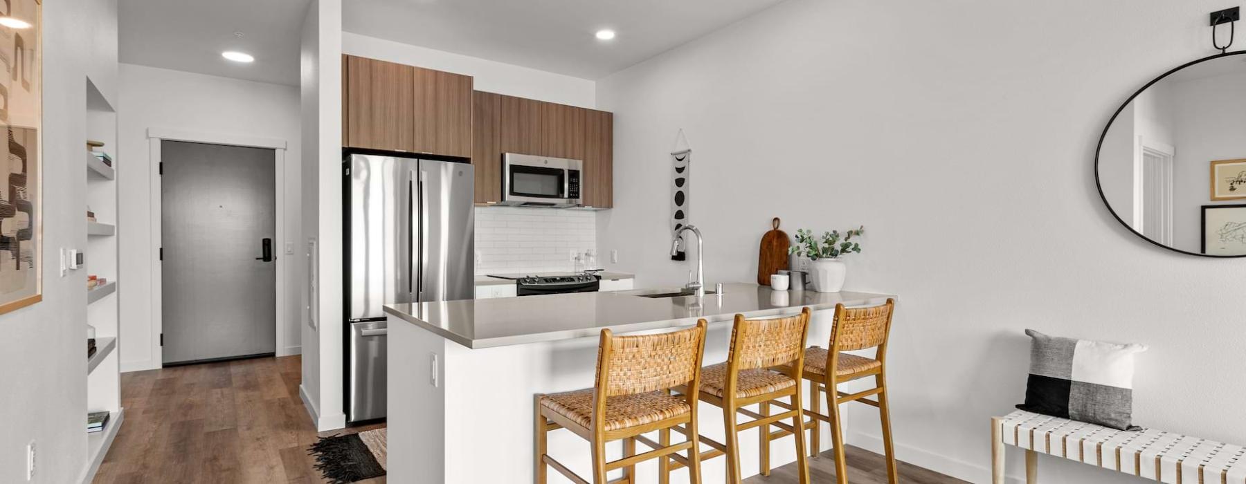 a kitchen with a dining table and chairs